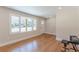 Living room with hardwood floors and large windows at 442 Mountain Park Trl, Stone Mountain, GA 30087