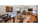 Cozy living room with hardwood floors, comfortable seating, and a view into the kitchen at 442 Mountain Park Trl, Stone Mountain, GA 30087