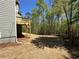 Spacious backyard area with a wooden deck, ideal for outdoor entertaining and relaxation at 66 Pine Creek Ct, Dallas, GA 30157