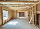 Unfinished basement with exposed framing and concrete floor at 66 Pine Creek Ct, Dallas, GA 30157