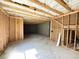 Unfinished basement with exposed framing and concrete floor at 66 Pine Creek Ct, Dallas, GA 30157