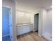 Bathroom features a dual sink vanity with granite counters and a glass enclosed shower at 66 Pine Creek Ct, Dallas, GA 30157