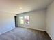 Bedroom with neutral paint, carpeted floor and window at 66 Pine Creek Ct, Dallas, GA 30157