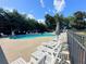 Community pool with ample lounge chairs and a relaxing atmosphere at 66 Pine Creek Ct, Dallas, GA 30157