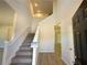 Entryway features the staircase with carpeted steps at 66 Pine Creek Ct, Dallas, GA 30157