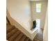 View from the top of the stairway down into the foyer of the home at 66 Pine Creek Ct, Dallas, GA 30157