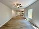Open-concept living room with hardwood floors and a ceiling fan at 66 Pine Creek Ct, Dallas, GA 30157