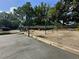 Community playground with a jungle gym, basketball court, swings, and seesaw at 66 Pine Creek Ct, Dallas, GA 30157