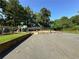 Community playground includes a jungle gym and basketball court for outdoor activities at 66 Pine Creek Ct, Dallas, GA 30157