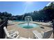 Resort style pool featuring a splash fountain and plenty of lounge chairs at 66 Pine Creek Ct, Dallas, GA 30157