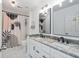 Contemporary bathroom featuring double sinks, granite counters, and stylish fixtures at 1981 Sumter Ct, Lawrenceville, GA 30044