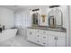Bright bathroom featuring double sinks, granite counters, and a modern soaking tub at 1981 Sumter Ct, Lawrenceville, GA 30044