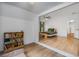 View of bedroom and sitting area with wood floors, light walls, and an open floor plan at 1981 Sumter Ct, Lawrenceville, GA 30044