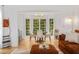 Dining area with a round table, chairs, bay windows, and hardwood floors at 1981 Sumter Ct, Lawrenceville, GA 30044
