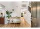 Bright foyer with light wood floors, a staircase, and a console table with decor at 1981 Sumter Ct, Lawrenceville, GA 30044