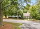 Charming neighborhood clubhouse with well-maintained landscaping and tennis courts in background at 1981 Sumter Ct, Lawrenceville, GA 30044