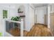 Upstairs hallway with natural light, wood floors, and neutral paint at 1981 Sumter Ct, Lawrenceville, GA 30044