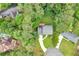 Home and neighborhood are seen from above, surrounded by mature trees at 2210 Chrysler Ne Ter, Atlanta, GA 30345