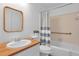 Bathroom featuring a single sink, bathtub, and wood countertop at 2210 Chrysler Ne Ter, Atlanta, GA 30345
