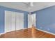 Bedroom featuring hardwood floors, a closet, and a ceiling fan at 2210 Chrysler Ne Ter, Atlanta, GA 30345