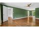Bedroom offering hardwood floors, green walls and a door leading to another room at 2210 Chrysler Ne Ter, Atlanta, GA 30345