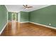 Bedroom featuring hardwood floors, green walls and a window providing natural light at 2210 Chrysler Ne Ter, Atlanta, GA 30345