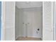 Empty closet features white louvered doors and pale grey interior walls with light wood floors at 2210 Chrysler Ne Ter, Atlanta, GA 30345