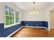 Bright dining room boasts natural light, chair rail, and hardwood floors at 2210 Chrysler Ne Ter, Atlanta, GA 30345