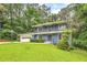 Charming two-story blue home featuring a spacious front yard and a two-car garage at 2210 Chrysler Ne Ter, Atlanta, GA 30345