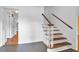 Welcoming foyer with hardwood floors, staircase and view to the kitchen at 2210 Chrysler Ne Ter, Atlanta, GA 30345