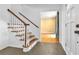 Welcoming foyer with hardwood floors, staircase and view to the living area at 2210 Chrysler Ne Ter, Atlanta, GA 30345