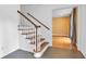 Welcoming foyer with hardwood floors, staircase and view to the living area at 2210 Chrysler Ne Ter, Atlanta, GA 30345