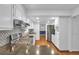 Modern kitchen with granite countertops, stainless appliances, and hardwood floors with an open design at 2210 Chrysler Ne Ter, Atlanta, GA 30345