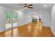 Bright living room with an open layout, hardwood floors, and access to the kitchen and outdoor deck at 2210 Chrysler Ne Ter, Atlanta, GA 30345