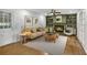 Living room with a decorative fireplace, built-in shelves, and hardwood floors at 2210 Chrysler Ne Ter, Atlanta, GA 30345