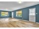 Spacious living room featuring new laminate flooring, windows, and doors that provide natural light at 2210 Chrysler Ne Ter, Atlanta, GA 30345