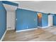 Spacious living room featuring new laminate flooring and unique ceiling lighting at 2210 Chrysler Ne Ter, Atlanta, GA 30345