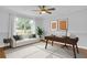 Bright office features a modern desk, couch, and large window with natural light at 2210 Chrysler Ne Ter, Atlanta, GA 30345