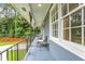 Inviting front porch with ample seating and wrought iron railings at 2210 Chrysler Ne Ter, Atlanta, GA 30345
