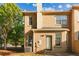Brick back exterior with door and multiple windows. AC unit on patio at 2735 Sudbury Trce, Norcross, GA 30071