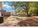 Backyard with mature trees, AC unit, and ample lawn space at 2735 Sudbury Trce, Norcross, GA 30071