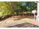 Backyard featuring trees, concrete patio and wooded area at 2735 Sudbury Trce, Norcross, GA 30071