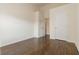 Empty bedroom featuring wood floors, neutral paint, and closet at 2735 Sudbury Trce, Norcross, GA 30071