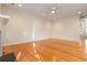 Large bonus room with hardwood floors and neutral paint, ready for customization at 2735 Sudbury Trce, Norcross, GA 30071