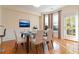Cozy dining area with a glass table, neutral decor, and natural light at 2735 Sudbury Trce, Norcross, GA 30071