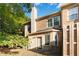 Rear exterior of brick home featuring a chimney and fenced in yard and outdoor living space at 2735 Sudbury Trce, Norcross, GA 30071