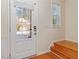 Bright foyer with hardwood floors, white door and a glimpse of the outdoors at 2735 Sudbury Trce, Norcross, GA 30071
