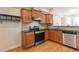 Well-equipped kitchen with stainless steel appliances and wood cabinets at 2735 Sudbury Trce, Norcross, GA 30071