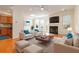 Spacious living room with hardwood floors, a fireplace, and comfortable seating at 2735 Sudbury Trce, Norcross, GA 30071