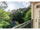 Balcony featuring a metal railing with views of the trees at 11 Perimeter E Ctr # 1412, Atlanta, GA 30346